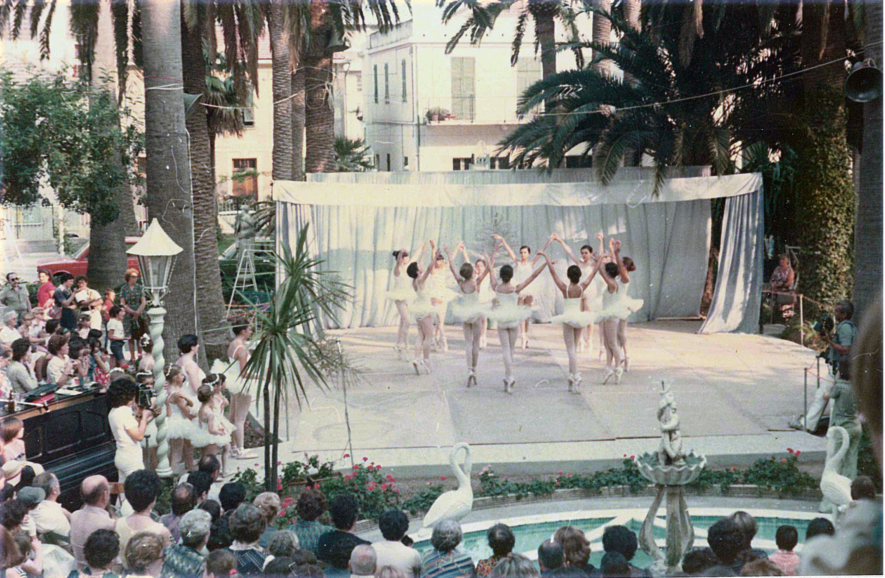 Young ballerinas performing on the garden stage